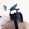 Fascinator mit Schleier und Federn
